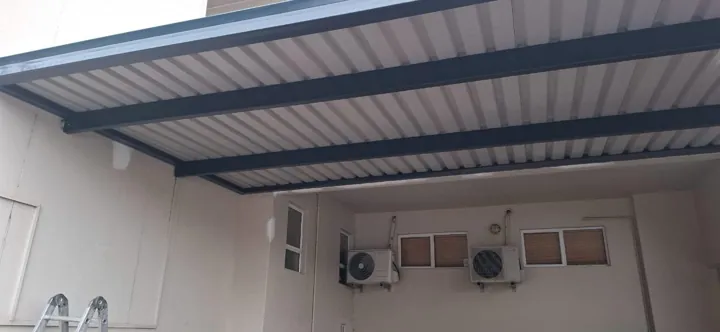 Underside of the installed IBR awning showing sheeting and the supporting steel frame.
