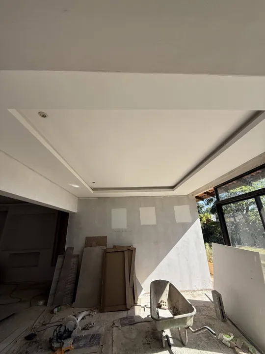 Recessed ceiling bulkhead with wall preparation and site materials below.
