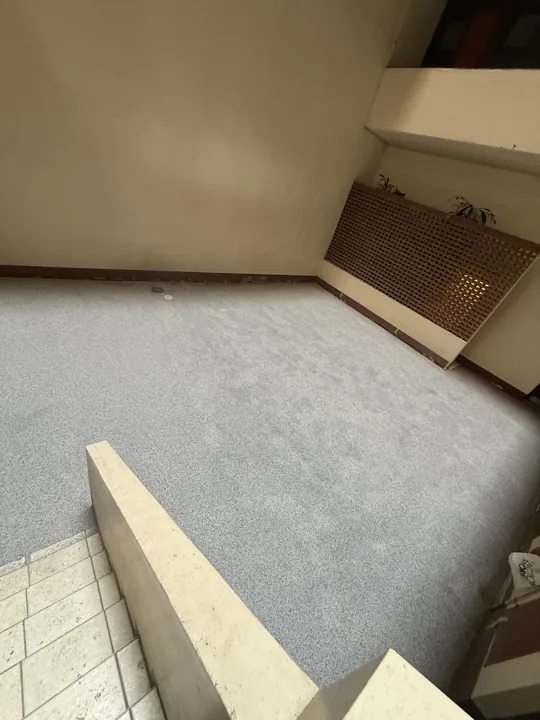 Alternative view of the completed speckled epoxy floor beside the steps in Amanzimtoti.